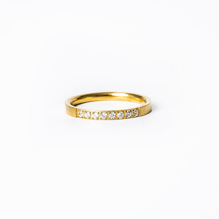 Paula gold ring standing in the center of the image against a white background 