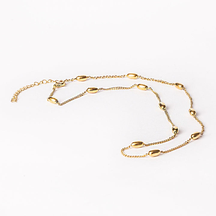 A yellow gold stainless steel necklace with a length of 50cm, featuring a design of circular charms or beads.