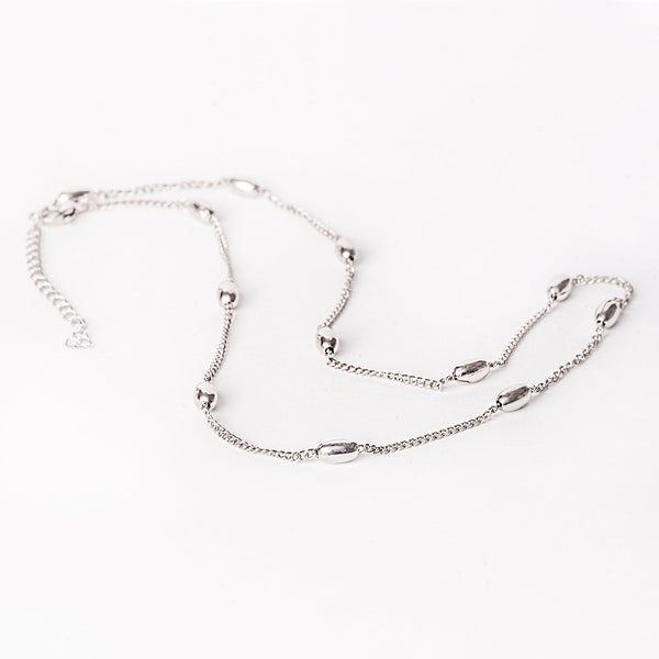 A silver stainless steel necklace with a simple design, featuring a chain-linked structure.