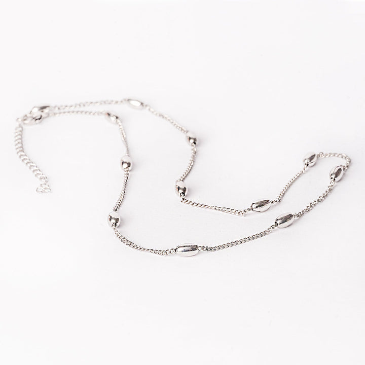 A silver stainless steel necklace with a simple design, featuring a chain-linked structure.