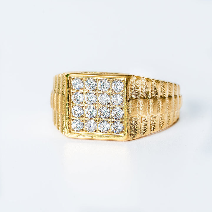 A close up view of a president ring, and its front view, standing against a white background. 