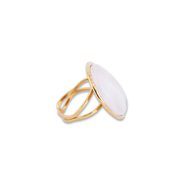 Gram Collections Gold ring with a white stone on a white background