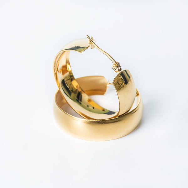Gold Remi Earrings featuring a sleek rounded design with a polished finish.