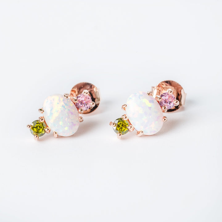 A close up view of rent set earrings standing in the center of the image against a white background. 