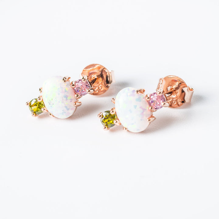 a gram collection ren set of earrings standing in the center of the image against a white background. 