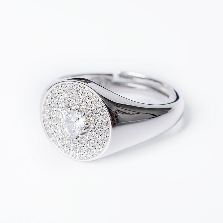 A profile view of Rena ring standing against a white background. 