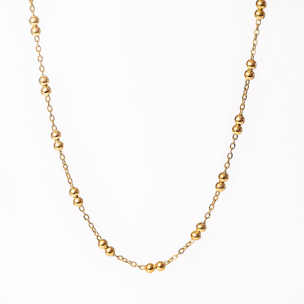 A yellow gold stainless steel necklace with a uniform length and a sleek design, displayed against a white background.