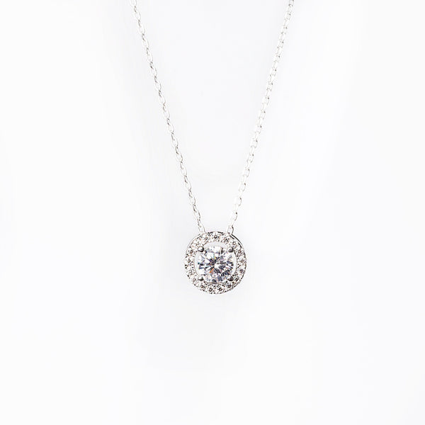 Rosie necklace close up standing in the center of the image against a white background. 