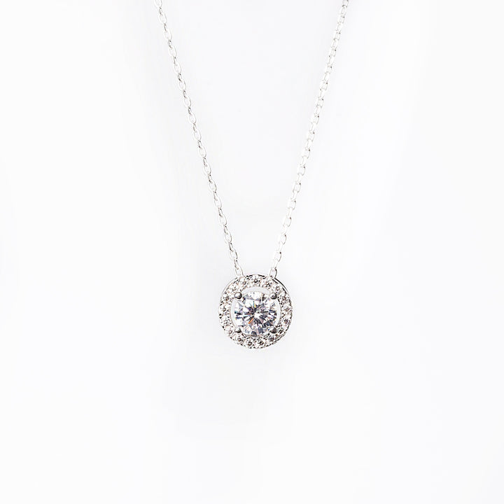 Rosie necklace close up standing in the center of the image against a white background. 