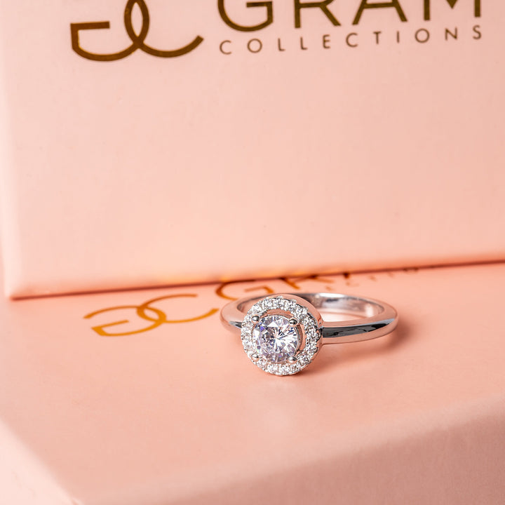 The Rosie Ring placed in the center of its uniquely designed pink box. 