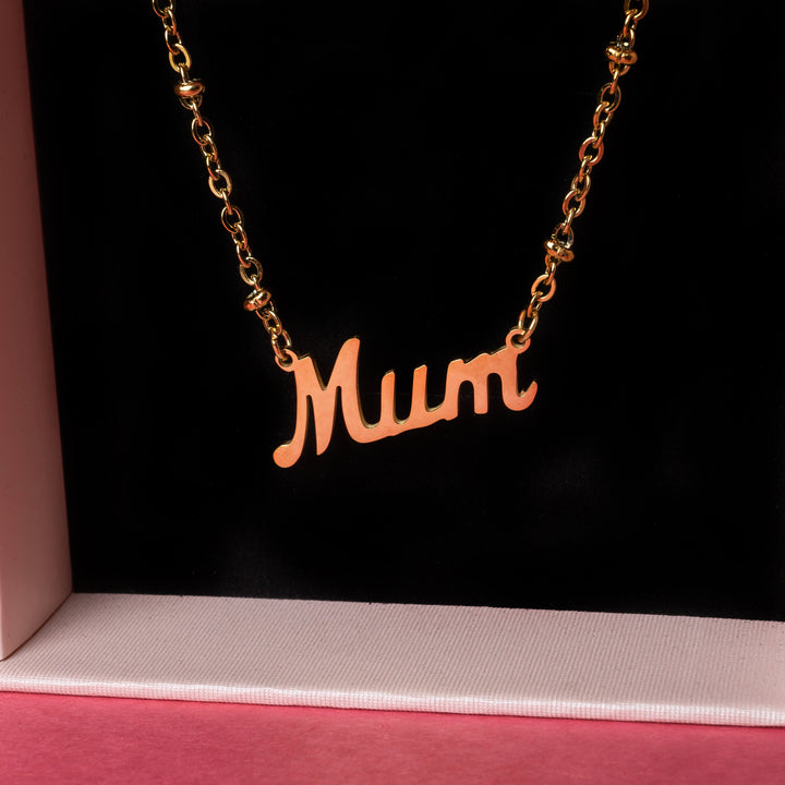 Rosina mum necklace close up view, standing inside its gift box. 