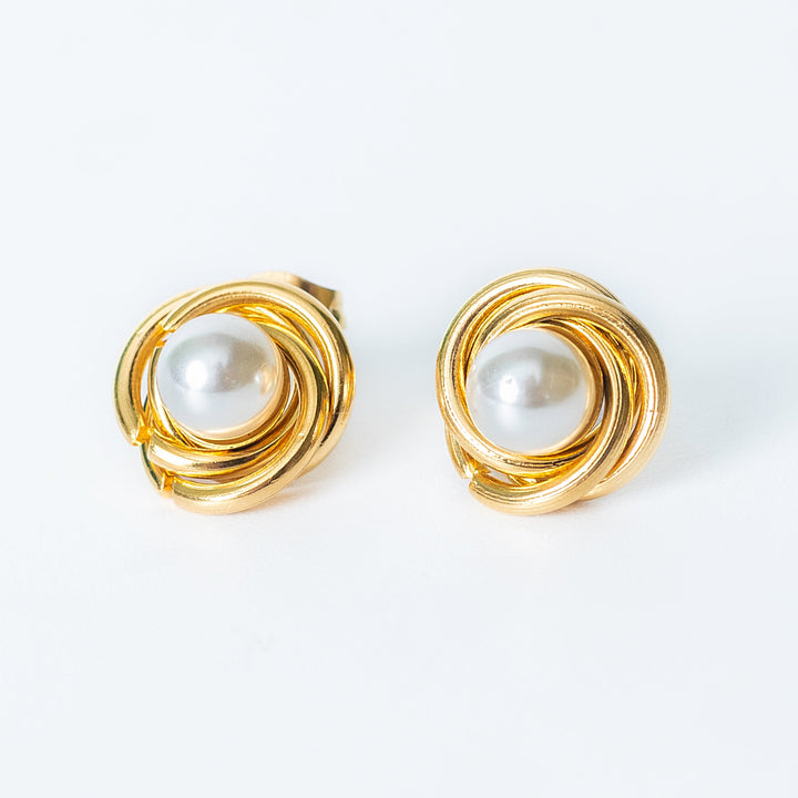 Ruth gold stud earrings with wrapped pearl design
