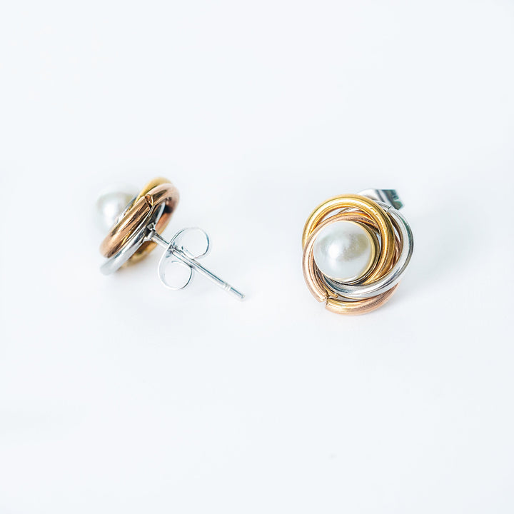 Ruth tricolor stud earrings with wrapped pearl design in side view
