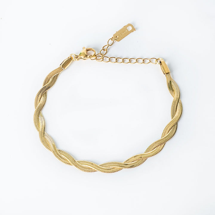 Gold Rylee bracelet shown from the top, featuring a twisted rope pattern with fine detailing.