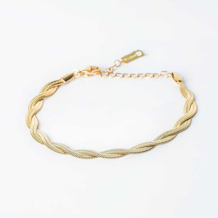 Gold Rylee bracelet featuring a twisted rope design with fine textured detailing.
