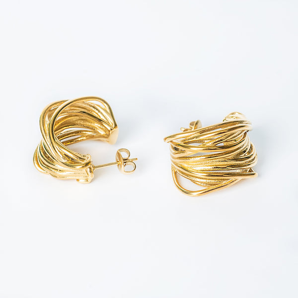 A pair of gold Sage Earrings with a modern twisted wire design