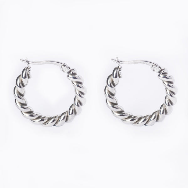 A bird view of  Samantha hoop earrings with a textured surface, displayed against a white background.