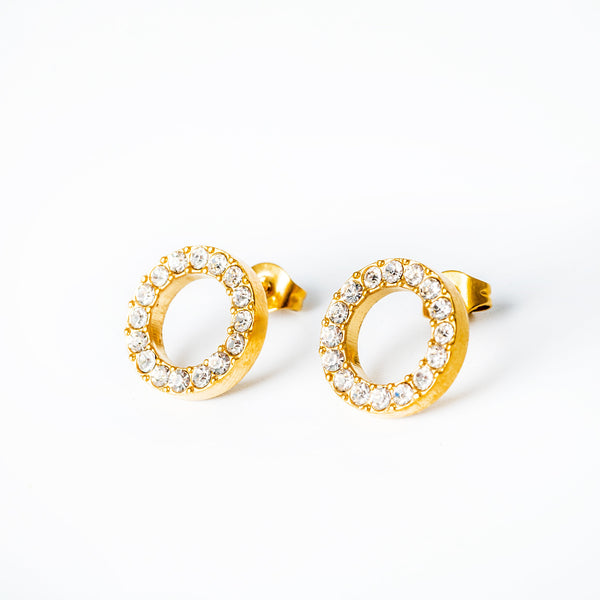 Samo earrings standing in the center of the image against a white background 