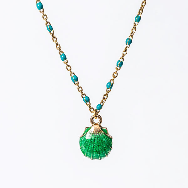 A yellow gold-plated stainless steel Seashell Necklace with a series of round beads and a central jade pendant shaped like a seashell.