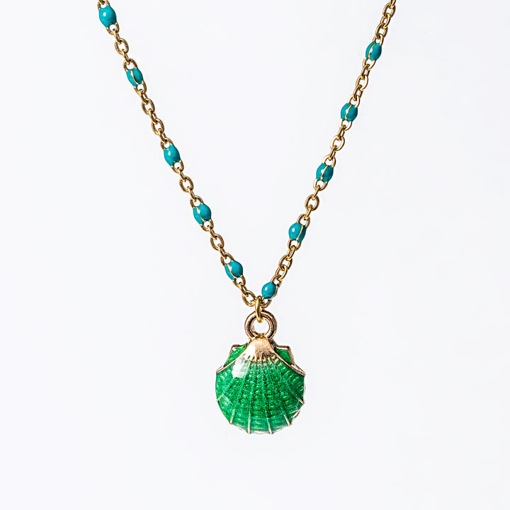 A yellow gold-plated stainless steel Seashell Necklace with a series of round beads and a central jade pendant shaped like a seashell.