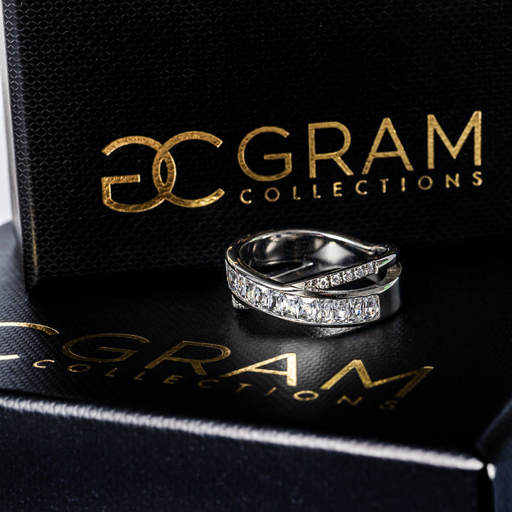 Shelly Silver Ring placed on its box, standing in the center of the image.