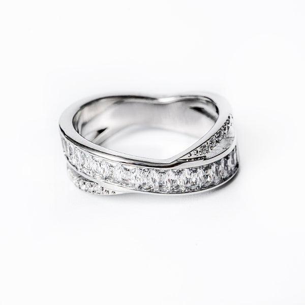 A silver-colored stainless steel ring with a gold plating, featuring a split design with cubic zirconia embellishments.
