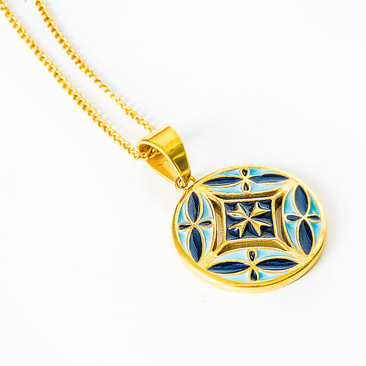 A side view of Malta necklace standing in the center of the image against a white background 