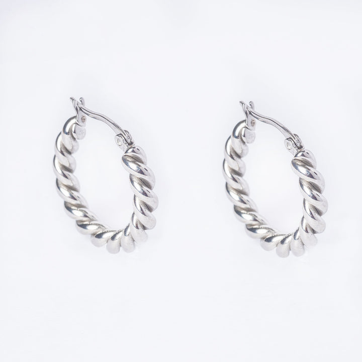 A side view of Samantha Silver Earrings standing in the center of the image against a white background. 