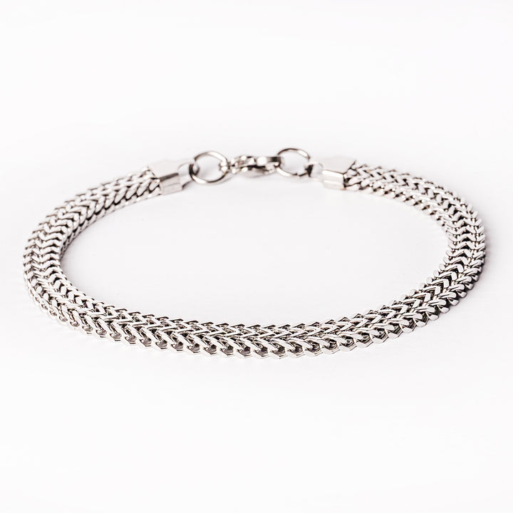 A silver stainless steel bracelet with a solid pattern and a clasp closure.