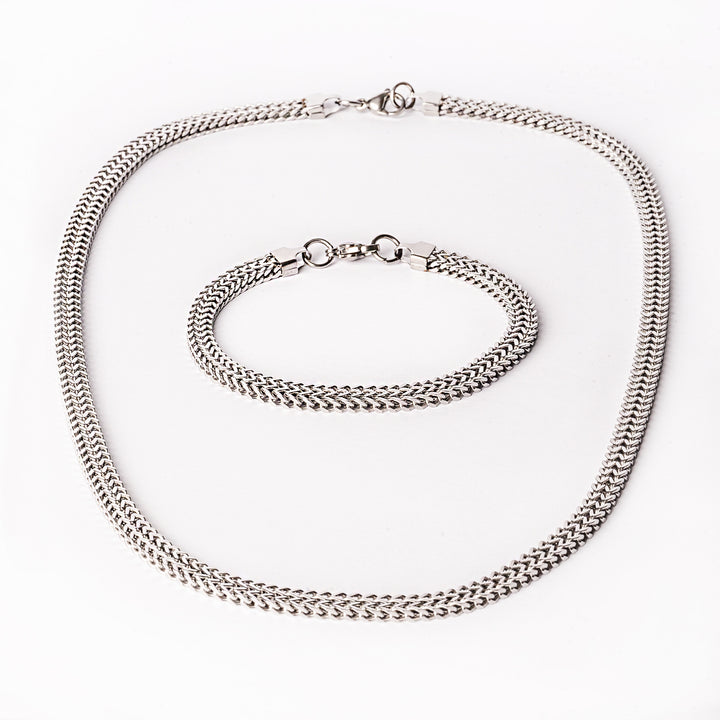 Sienna silver necklaces standing in the center of the image against a white background. 