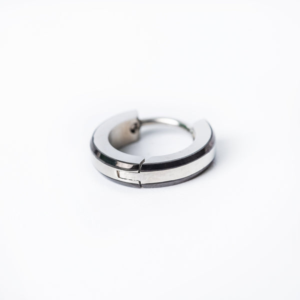 A single silver-colored Simon hoop earring made of stainless steel, displayed against a white background.