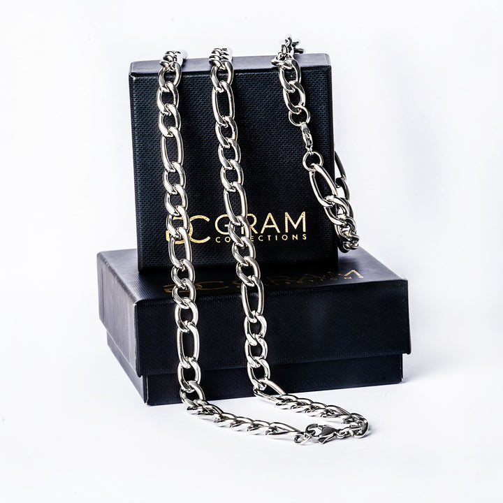 A Siracusa Necklace standing in the center of the image against a white background placed onto its box. 