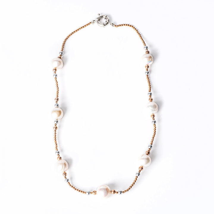 A sky necklace view from a bird view standing in the center of the image against a white background 