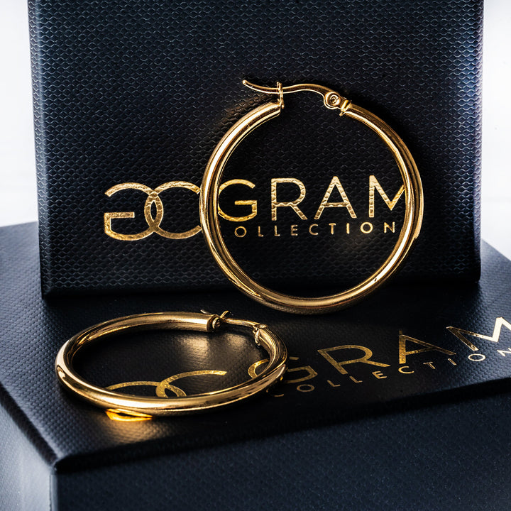 A stefania fold earrings standing in the center of the image. 