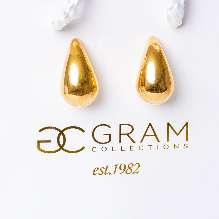 Stella Gold Earrings attached to their uniquely designed box. 
