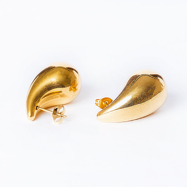 A pair of gold-plated stainless steel hoop earrings on a white background.