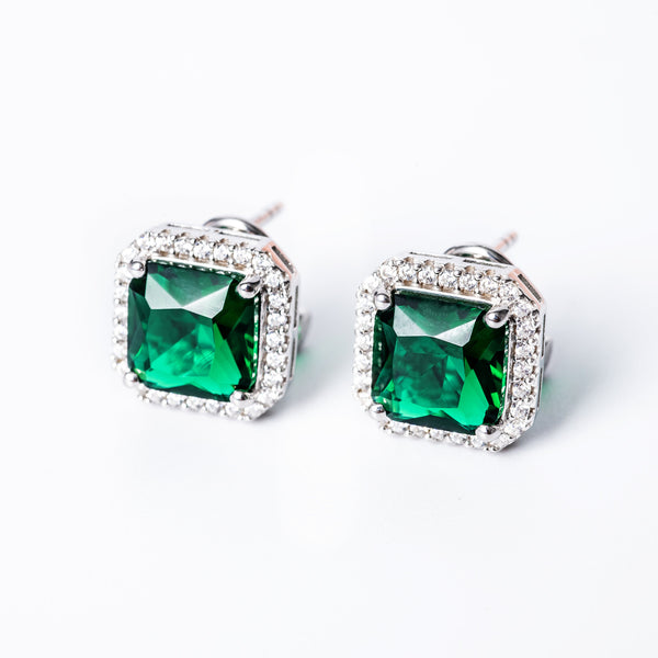 A close up view of Susan Earrings standing against a white background. 