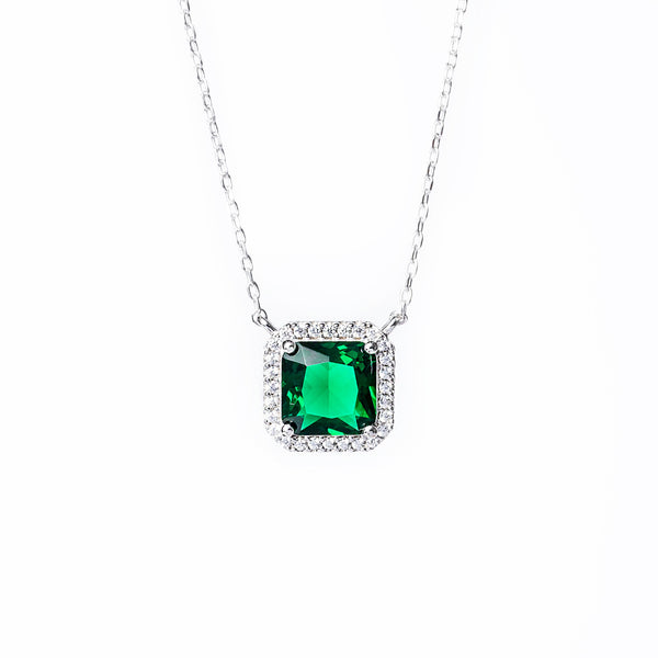 A close up view of Susan necklace standing in the center of the image against a white background. 