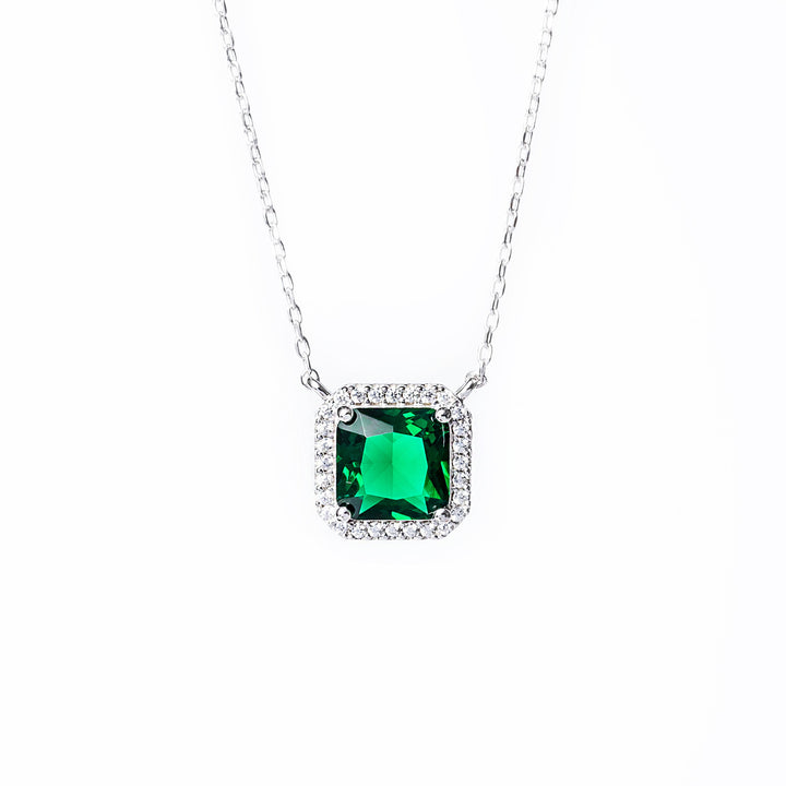 A close up view of Susan necklace standing in the center of the image against a white background. 