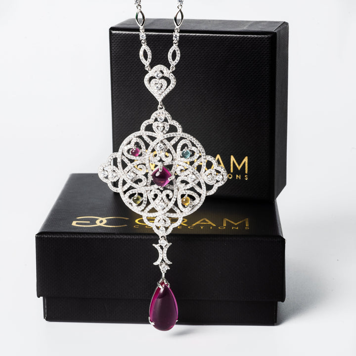 Tamara Necklace standing in the front of the image, while behind is its uniquely designed box. 