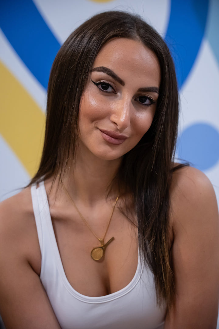 a local tennis player wearing gram collections's The Tennis Necklace. 