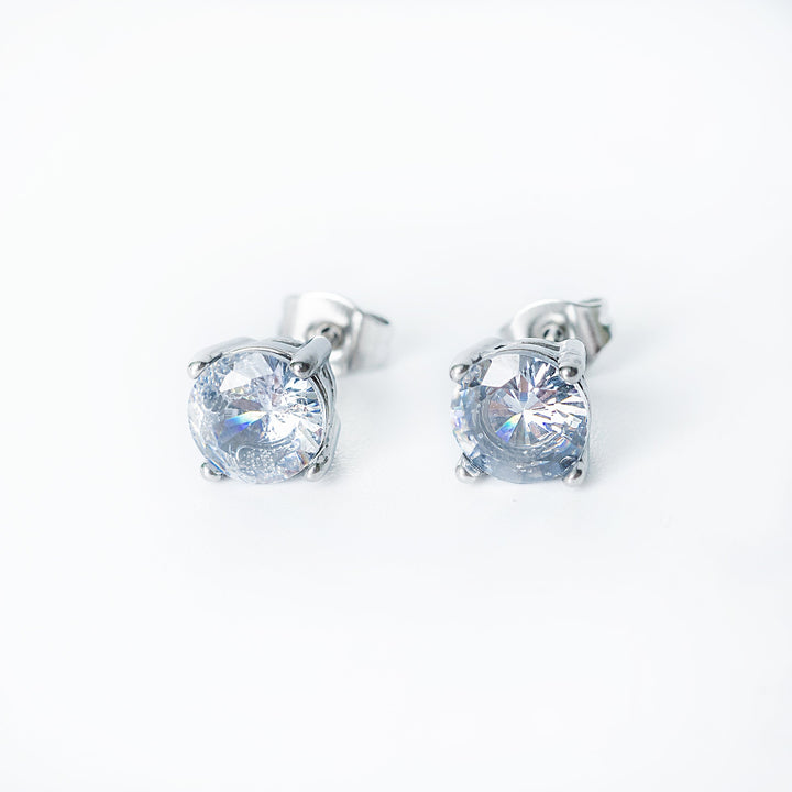 Silver Tessa stud earrings with round clear gemstones in a prong setting.
