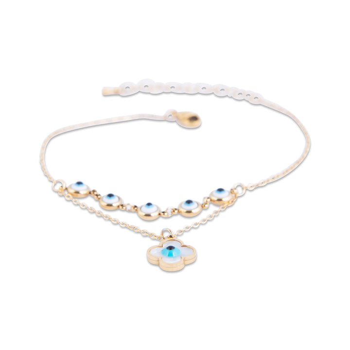 anklet with blue evil eye charms on a white background
