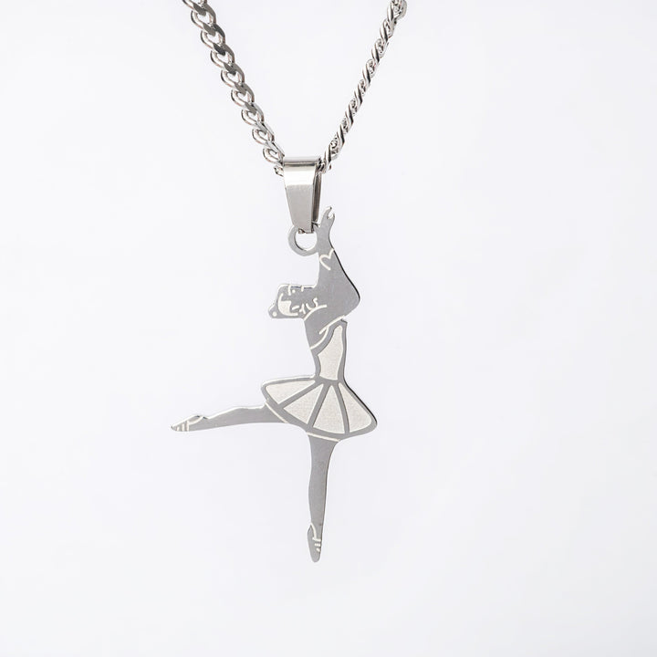 The ballerina necklace close up view standing in the center of the image against a white background. 