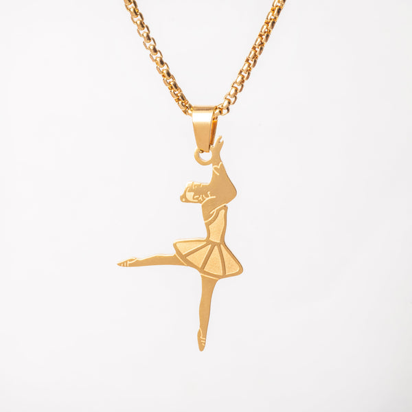 The ballerina necklace standing in the center of the image against a white background. 