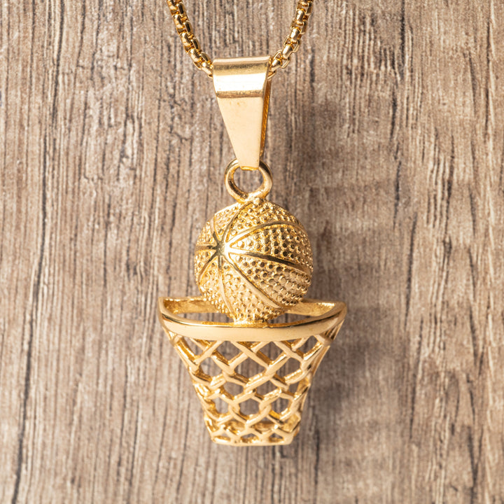 The Basketball Player Necklace stand in front of the wooden background. 
