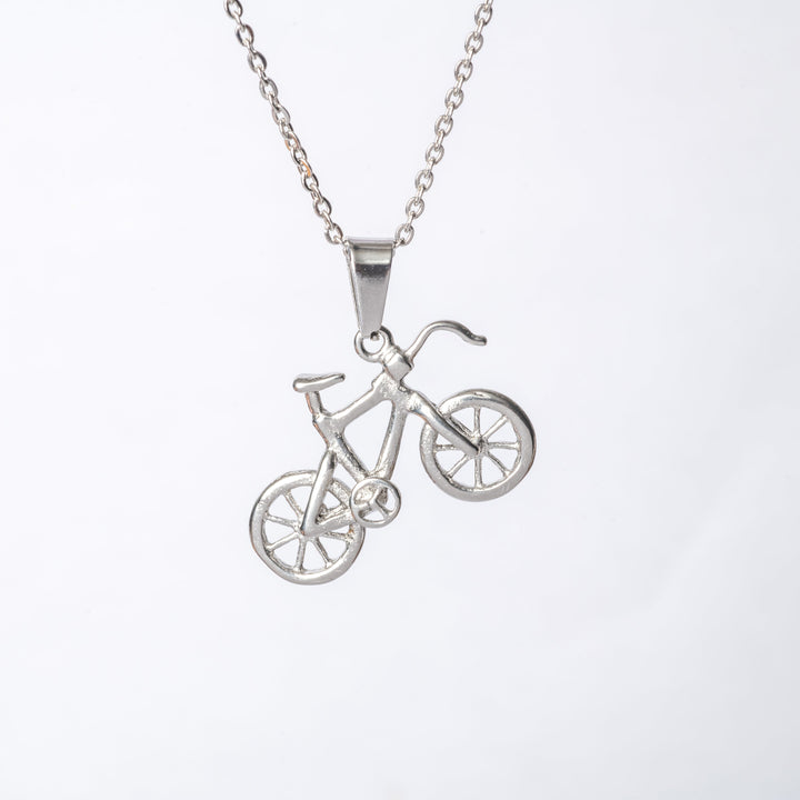 A close up view of Biker necklace standing in the center of the image against a white background. 
