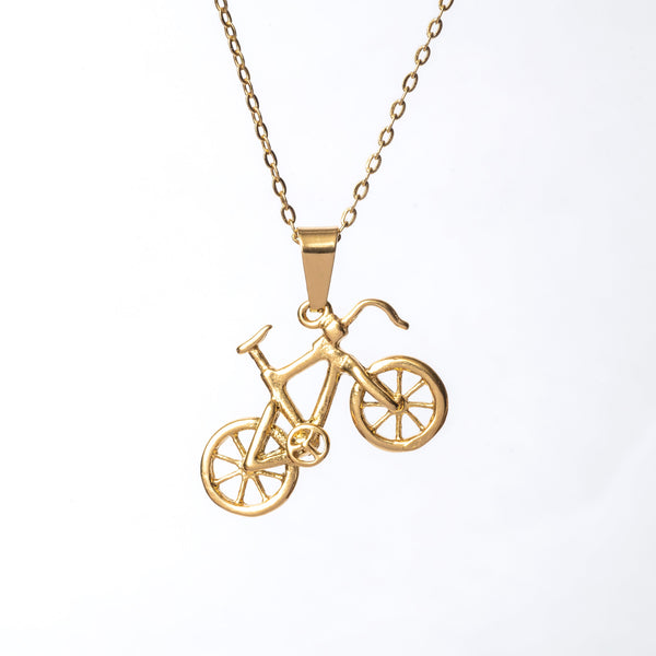 A gold-plated stainless steel bicycle pendant necklace with a chain.