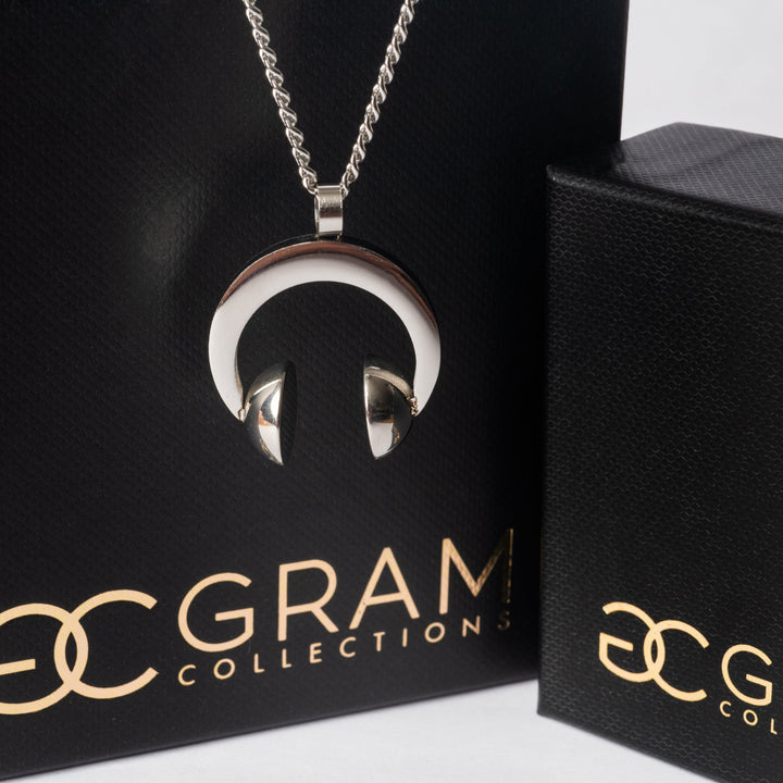 The dj necklace of gram collections standing on the left side of the surrounded with its black box 