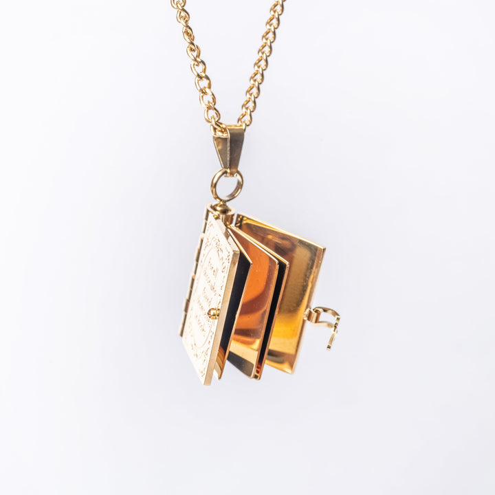 The educational necklace attached to its chain, standing in the center of the image, seeing from front view. 